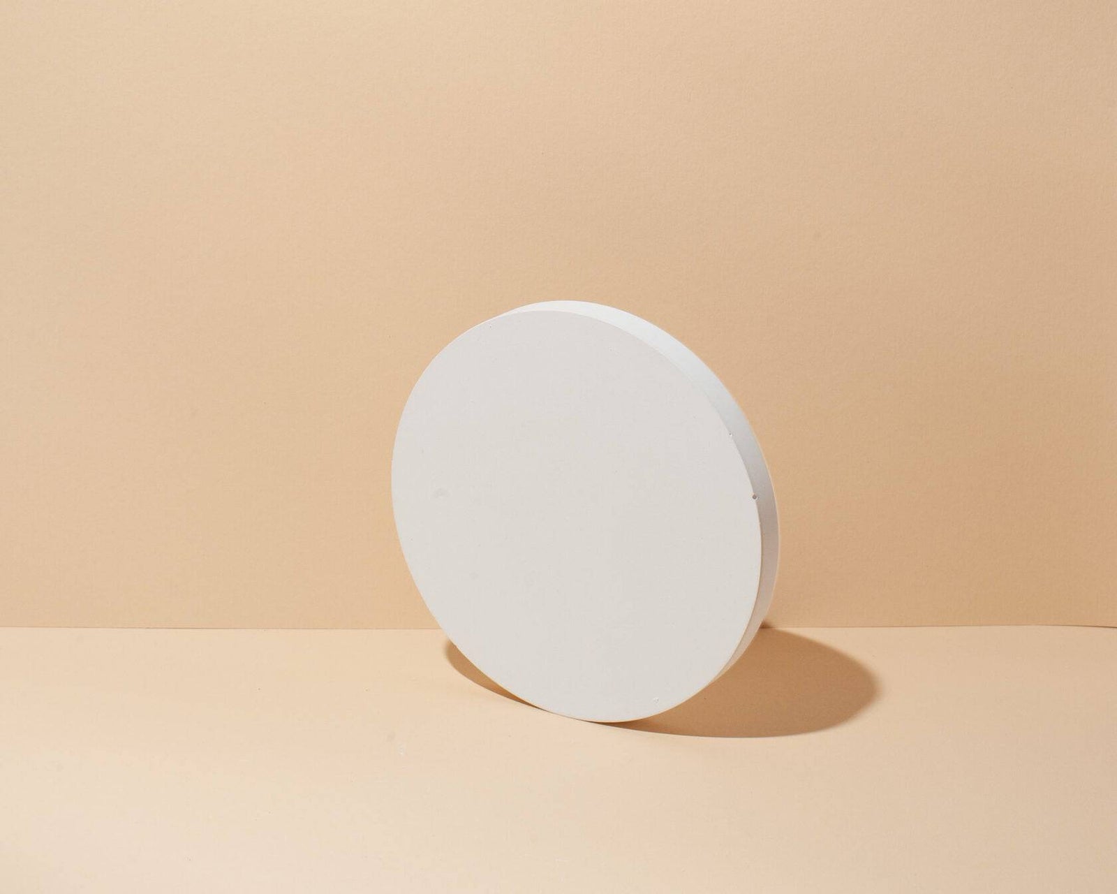 Round mineral display podium used to create height in a jewelry presentation