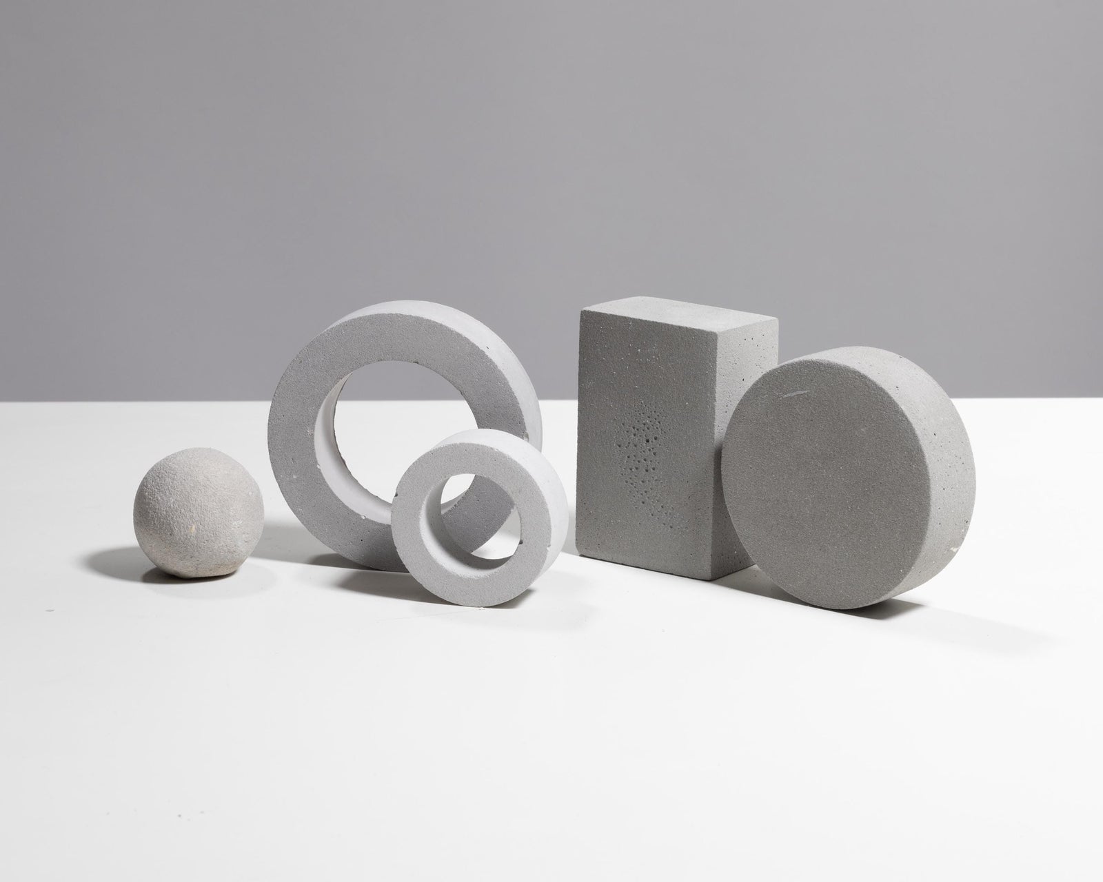 Betonvton light grey jewelry photography prop set with sphere, rings, block and disc
