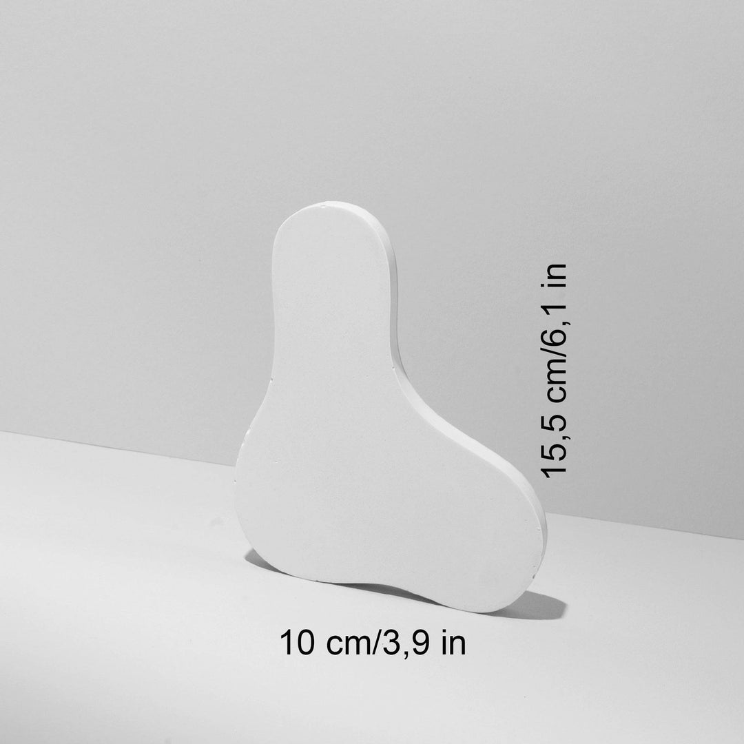 Compact sculptural riser 10 by 15.5 cm in handmade white gypsum, ideal for earring displays, ring presentation, and small cosmetic product photography