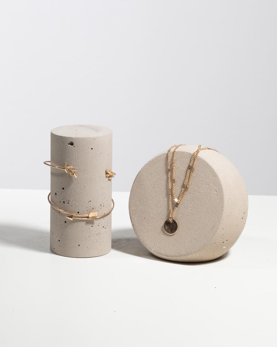 Sculptural mineral display set styled for jewelry brand photography