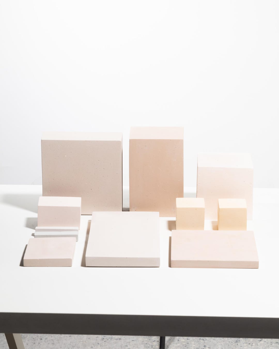 Geometric display blocks arranged as a layered jewelry presentation set