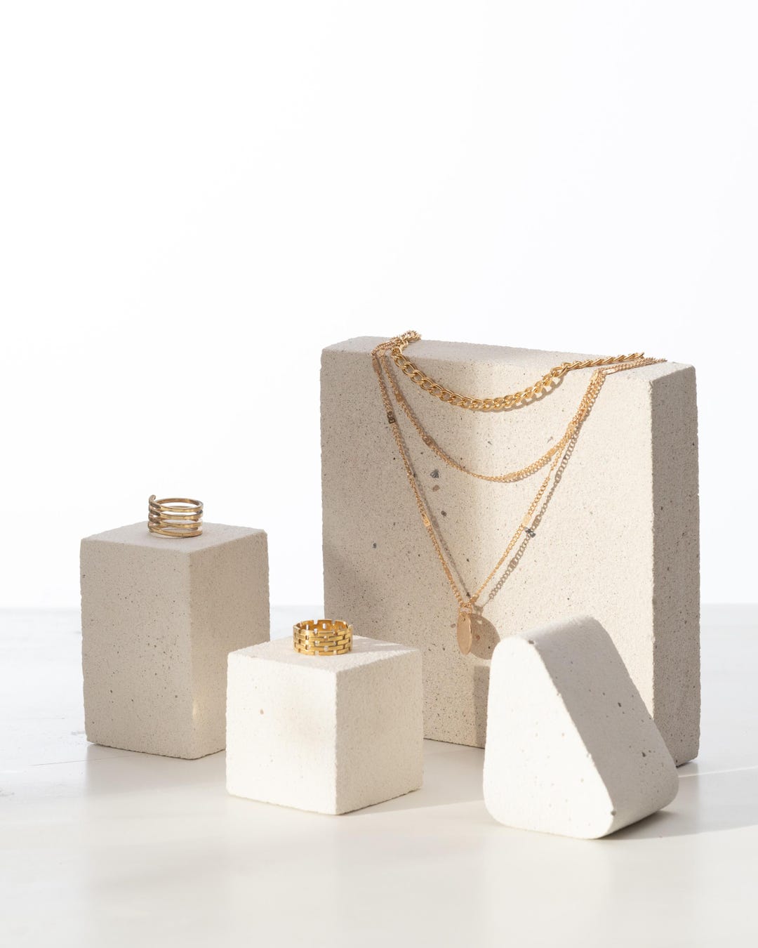 Off white jewelry display cubes and blocks styled with jewelry