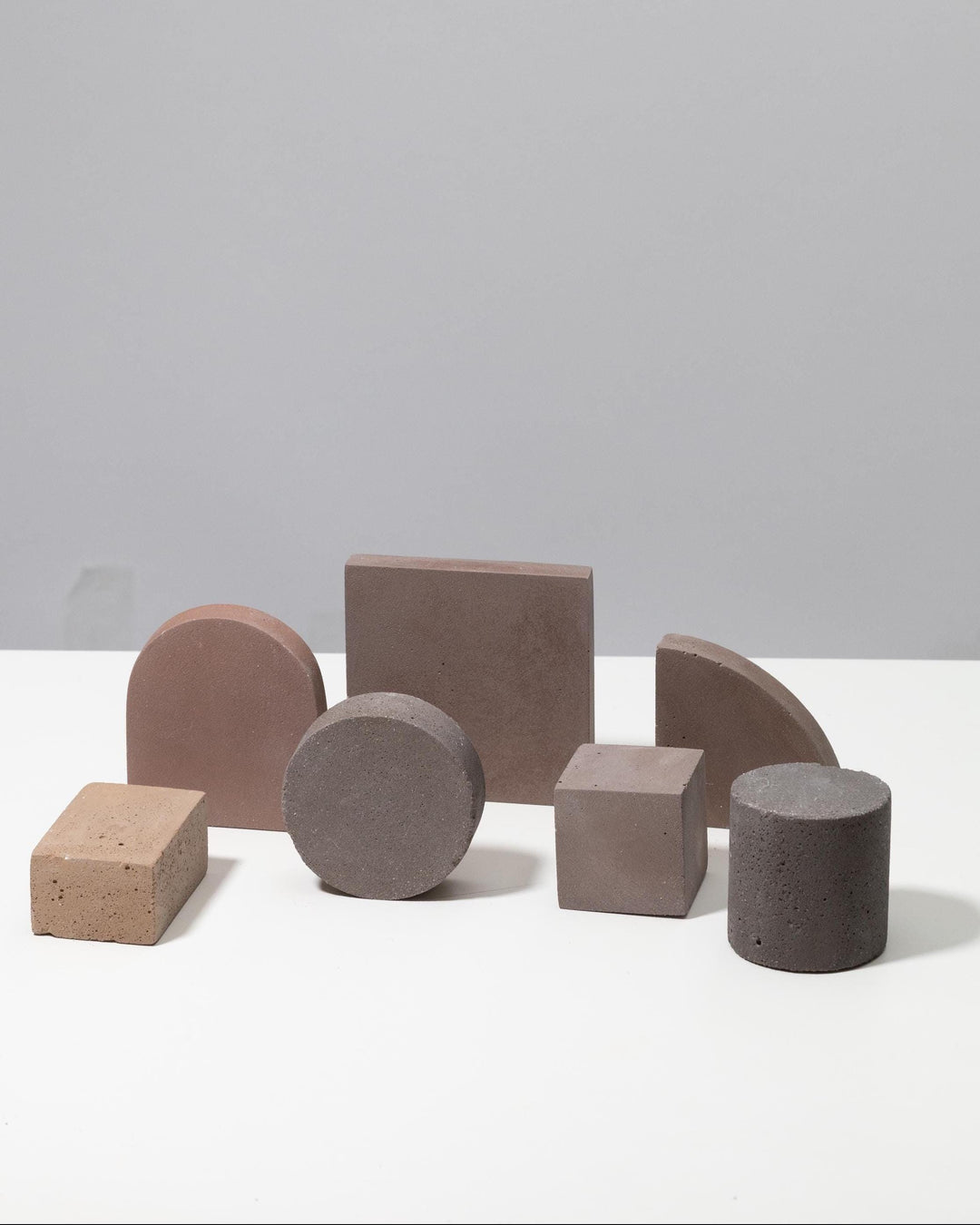 Mini geometric display blocks in warm beige, taupe, grey and brown tones