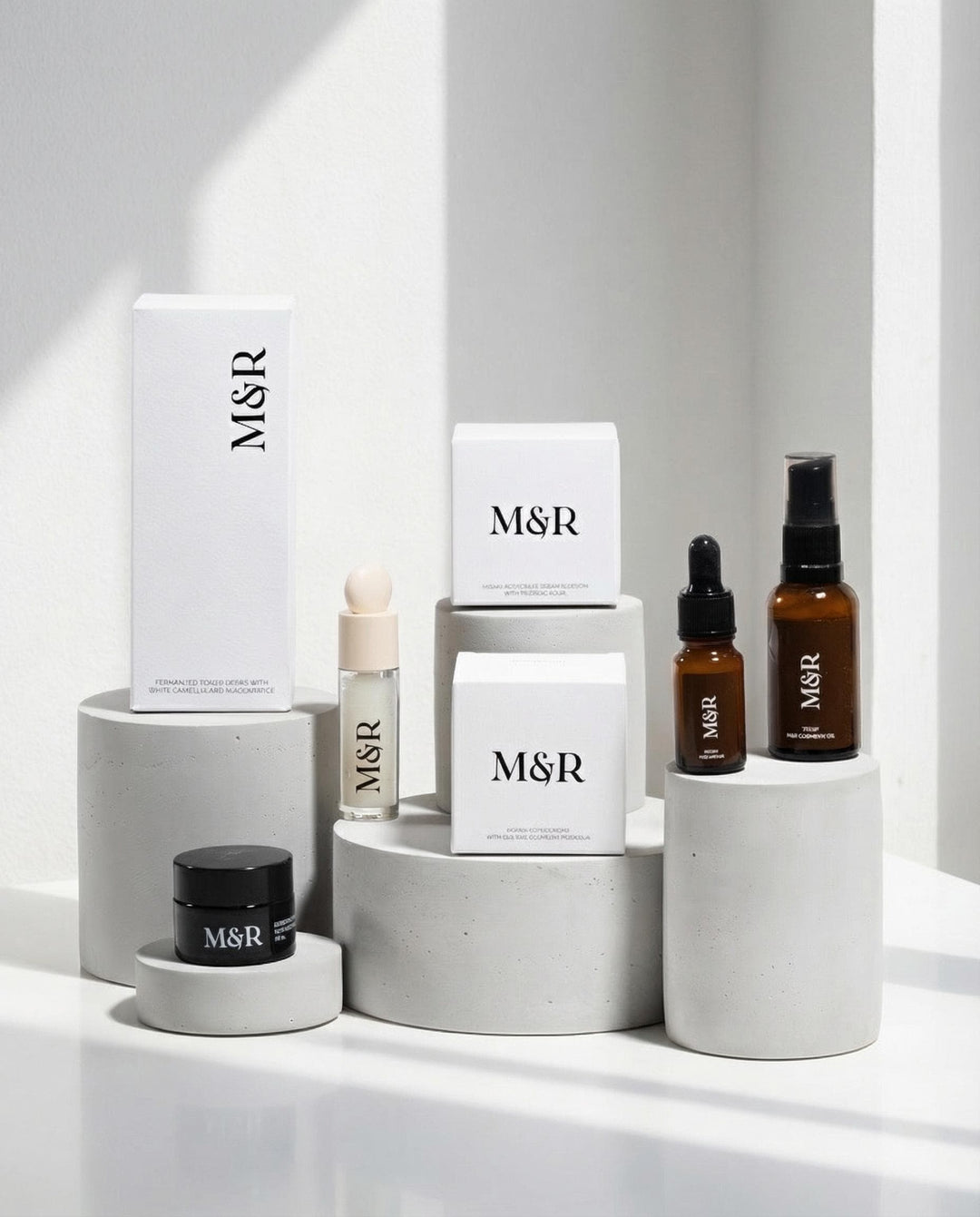 Concrete cylinder risers with luxury skincare packaging for retail presentation