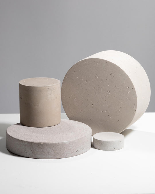 Light grey plaster disc and column display set of four pieces