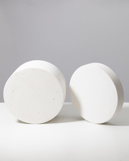 Two matte round platforms showing top and side profile