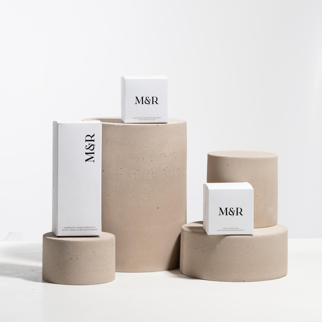 Concrete retail risers in beige styled with skincare packaging