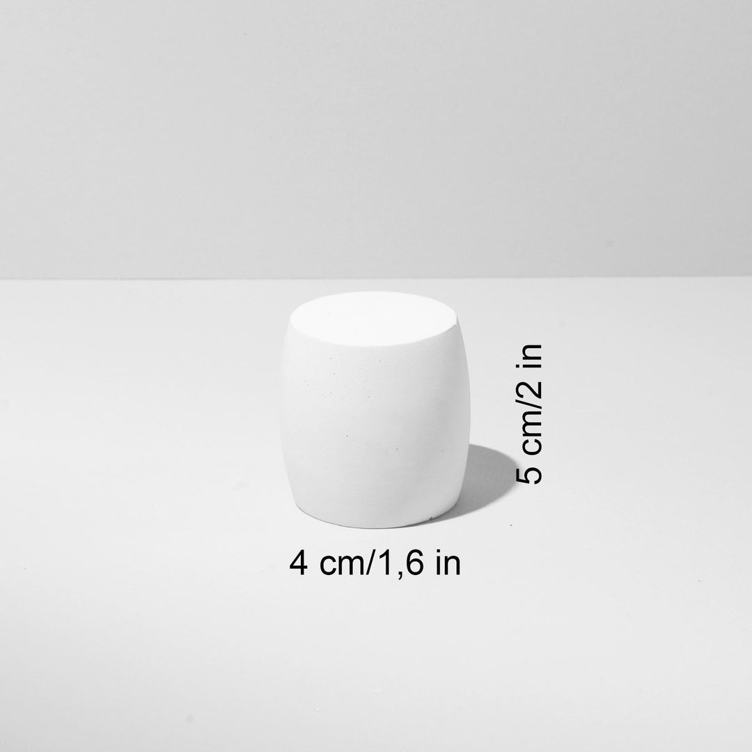 Light beige plaster display pedestals styled for jewelry presentation
