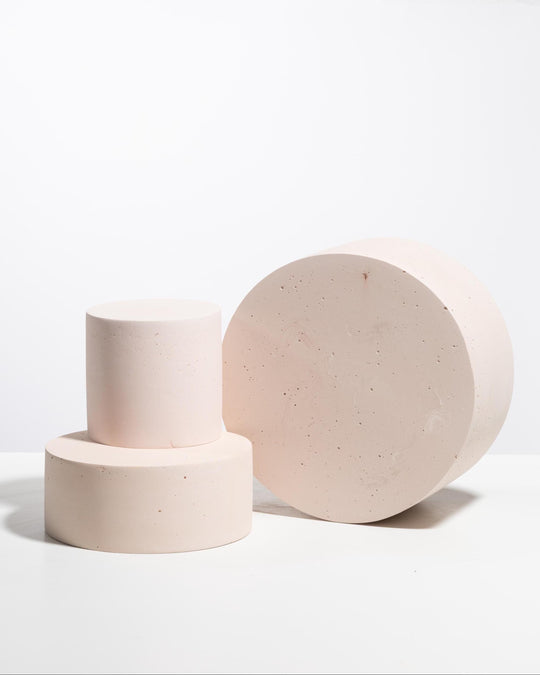 Blush pink cylinder pedestal set styled for product photography