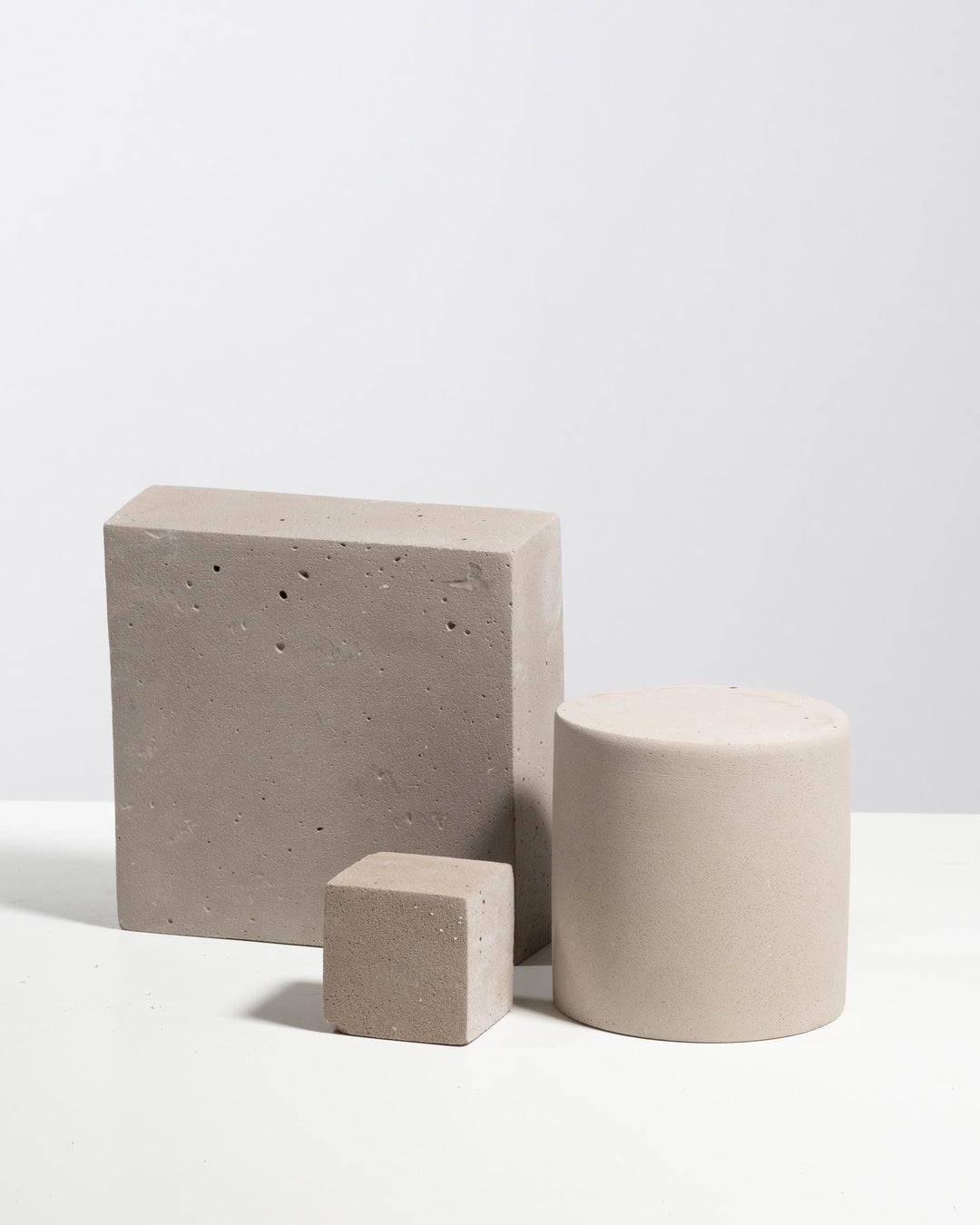 Light grey styling set with square platform, cylinder pedestal and cube